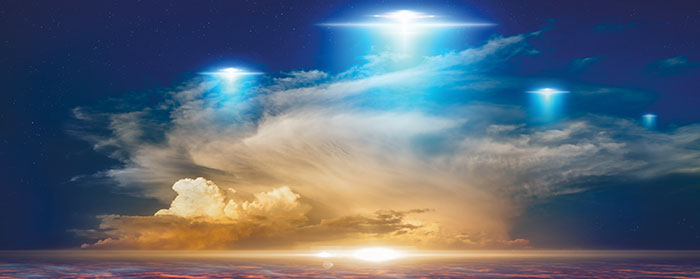 Three UFOs floating in the night sky