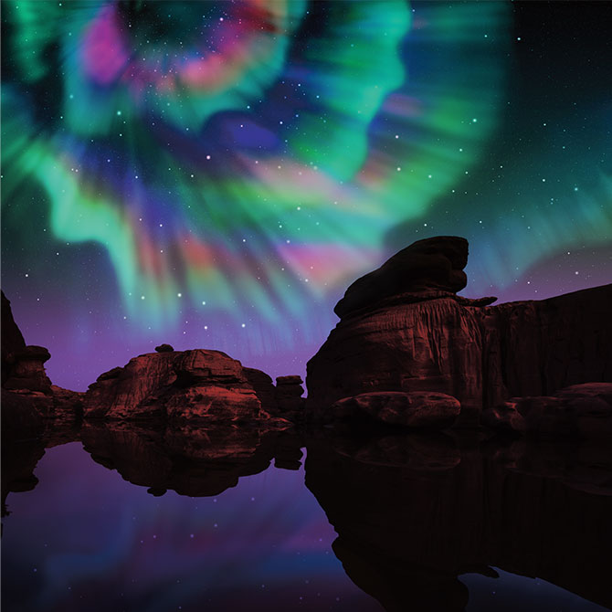Enlargeable photo of beautiful neon lights in the sky shining over canyons and water