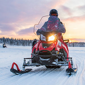 A person riding a snowmobile