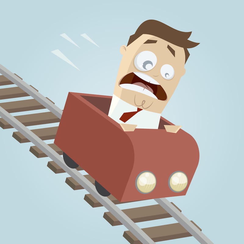 illustration of a man with a fearful expression riding a rollercoaster