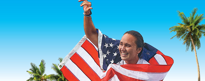 Image of person cheering while wrapped with an American flag