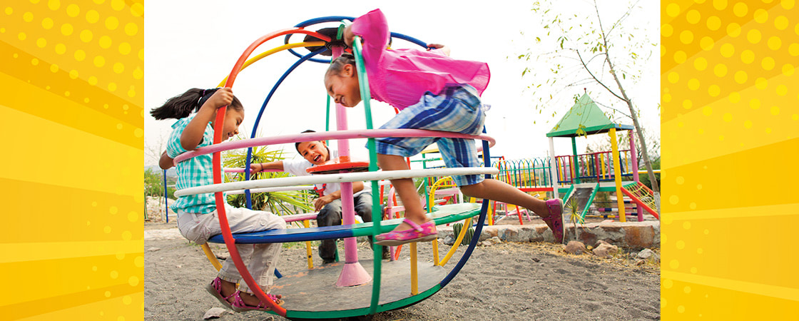 Image of kids playing in a plastic toy sphere